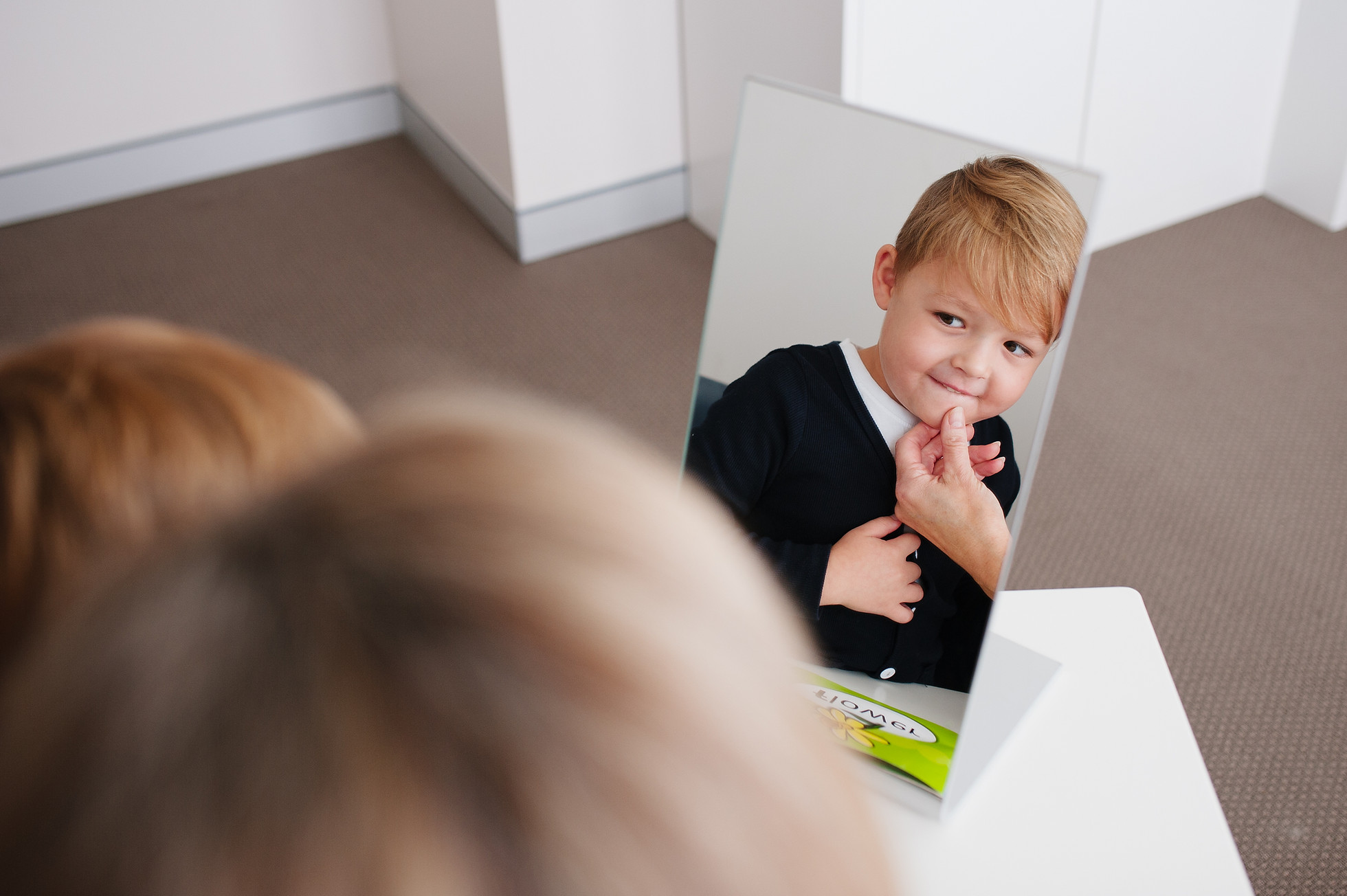 A speech pathologist working with a young child in a play-based therapy session at Speech Pathology Services' Burwood clinic.
